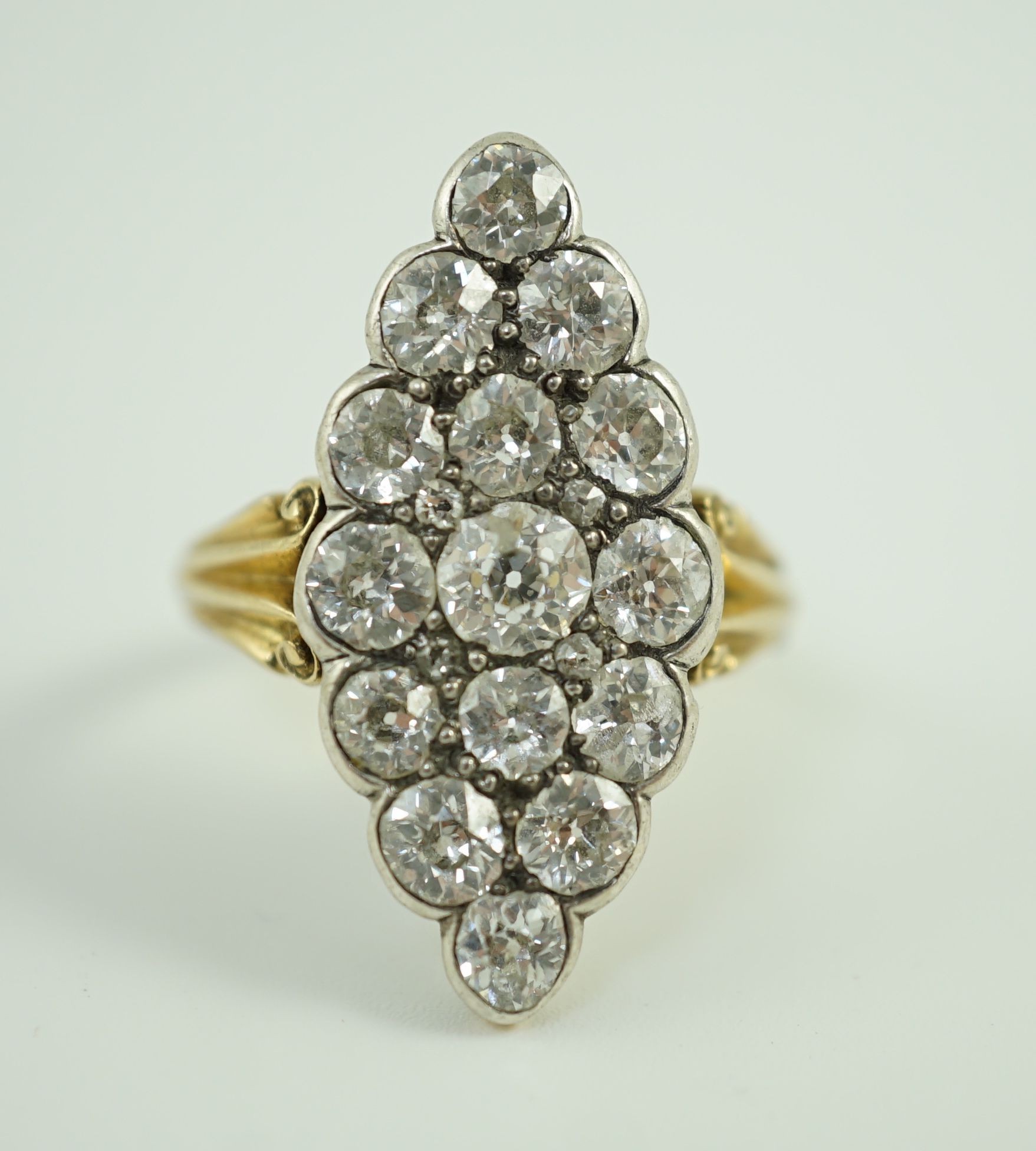 A Victorian style 18ct gold and fifteen stone diamond set marquise cluster dress ring